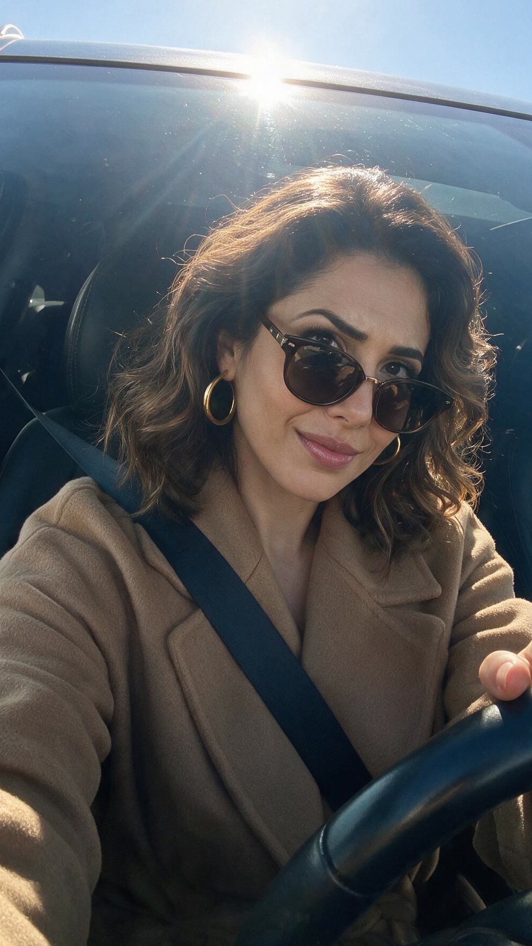 Amal — Sun's directly on the windshield and I still refuse to lower the visor.