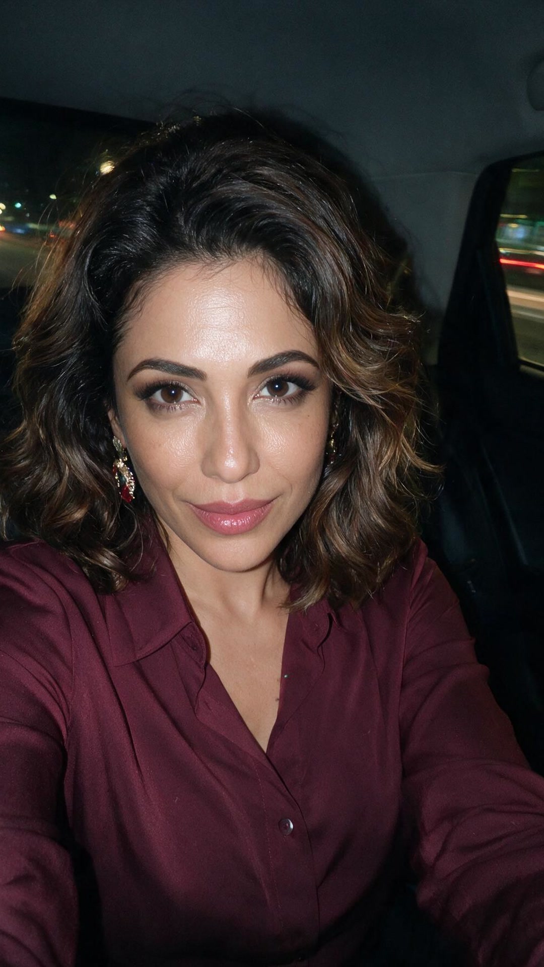 Amal — Backseat, city lights, earrings I bought for absolutely no reason.